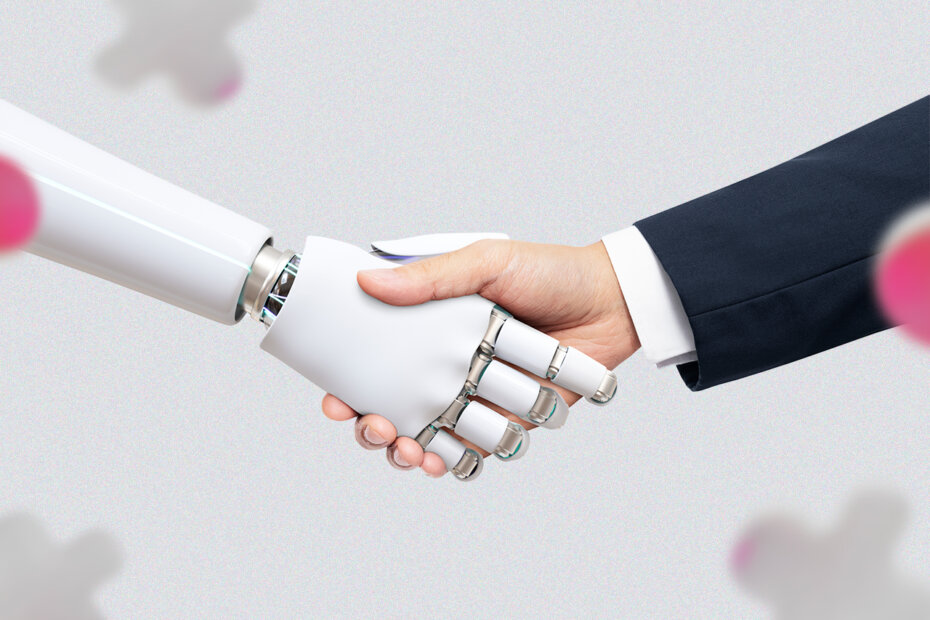 Uma mão humana e uma mão robótica apertando as mãos.